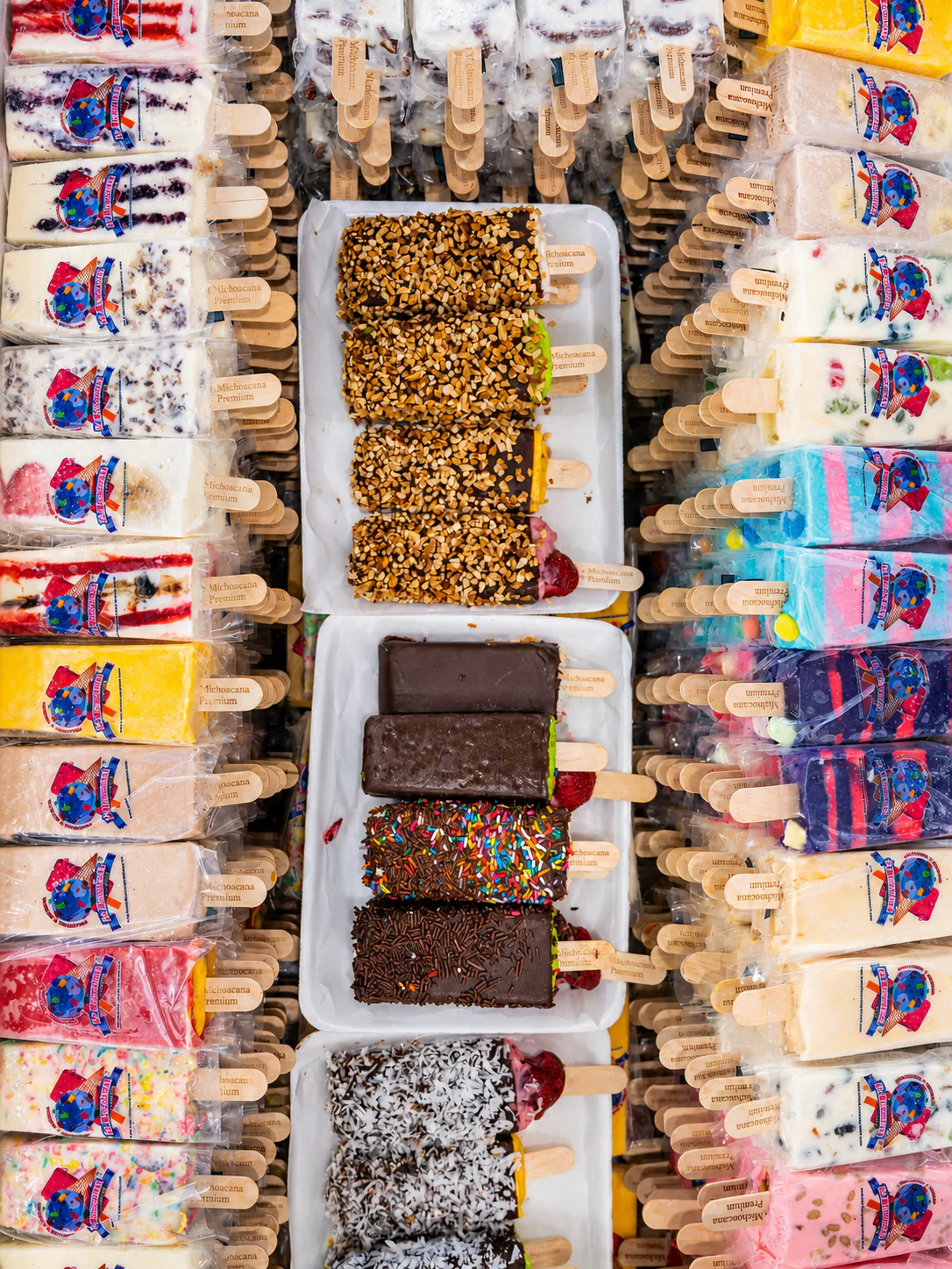 A rack of La Michoacana Premium paletas in assorted flavors.